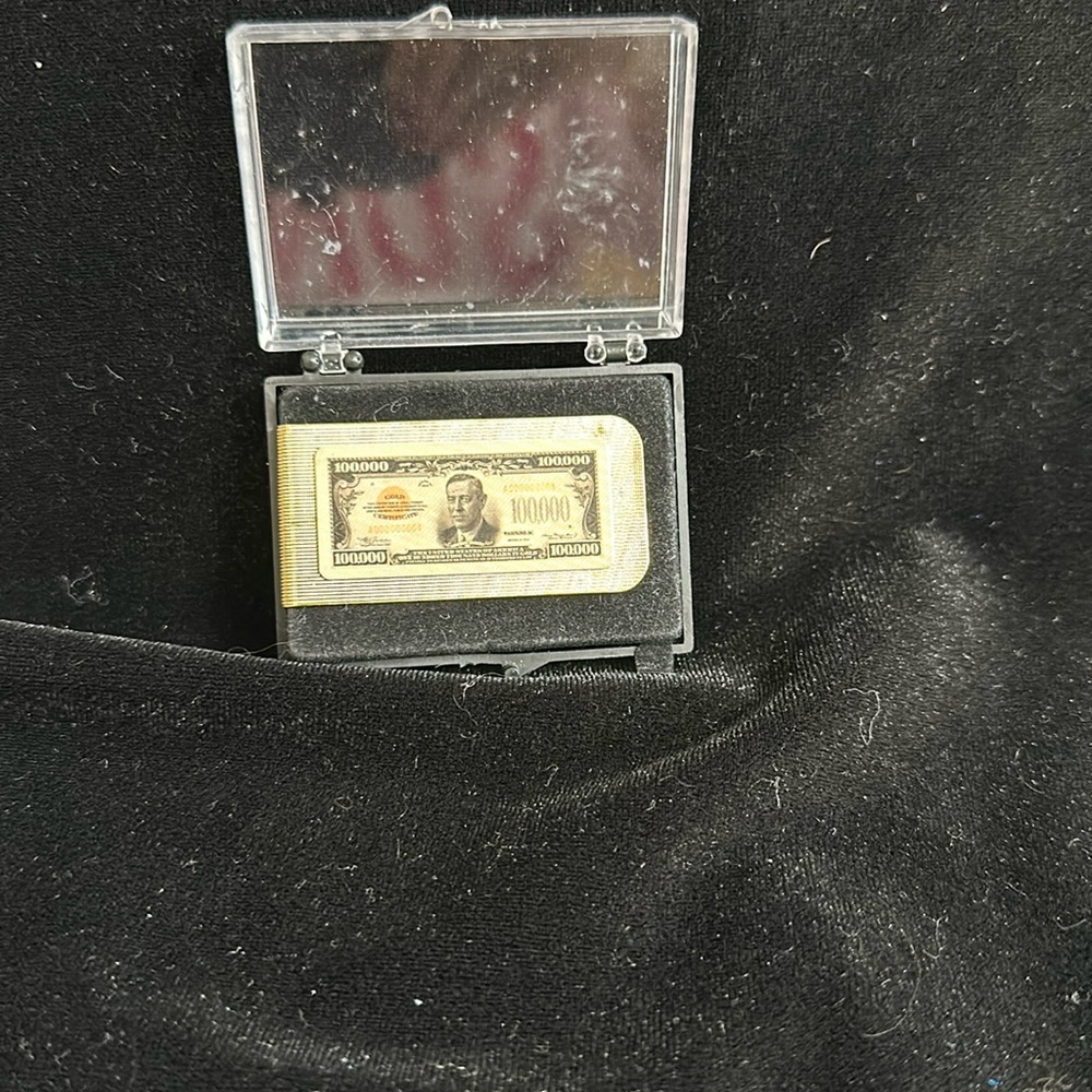 Gold tone money clip
